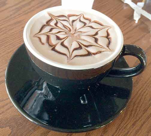 The design in the foam of my hot cocoa at the Tomato Pie Café